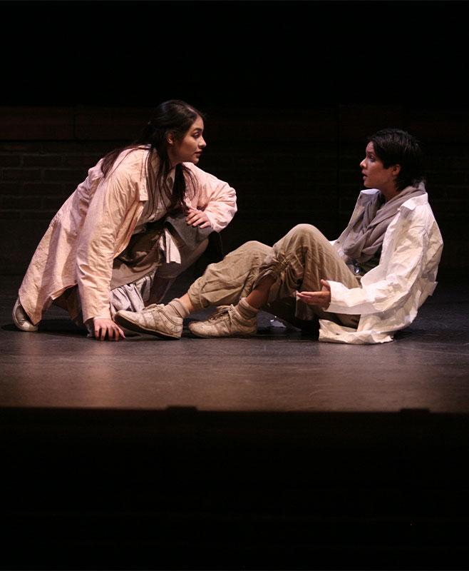 two people acting on stage