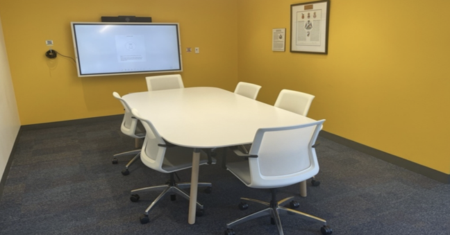 Small Meeting Room with table, chairs and screen